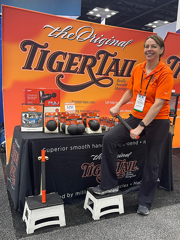 Spring_Rolling Spring Faussett rolling her legs with The Original 18" Handheld Foam Roller in a running convention