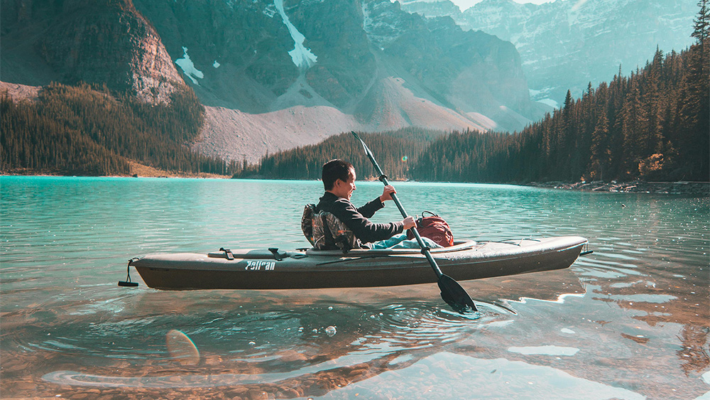 Man kayaking on a lake