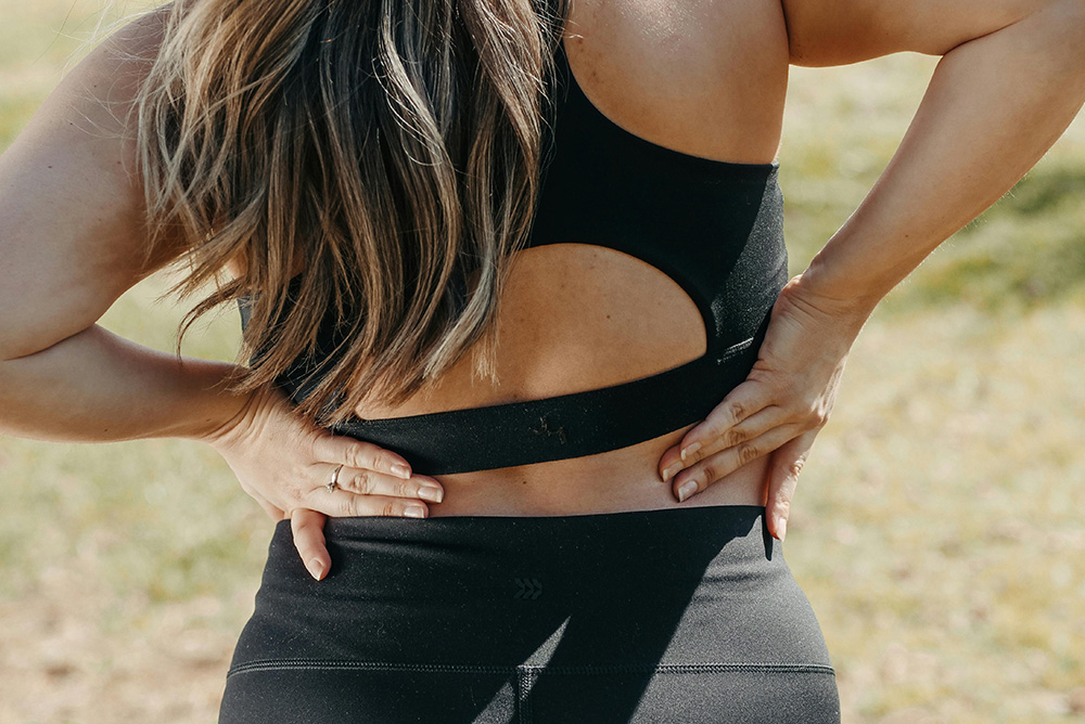 Woman Experiencing Lower Back Pain