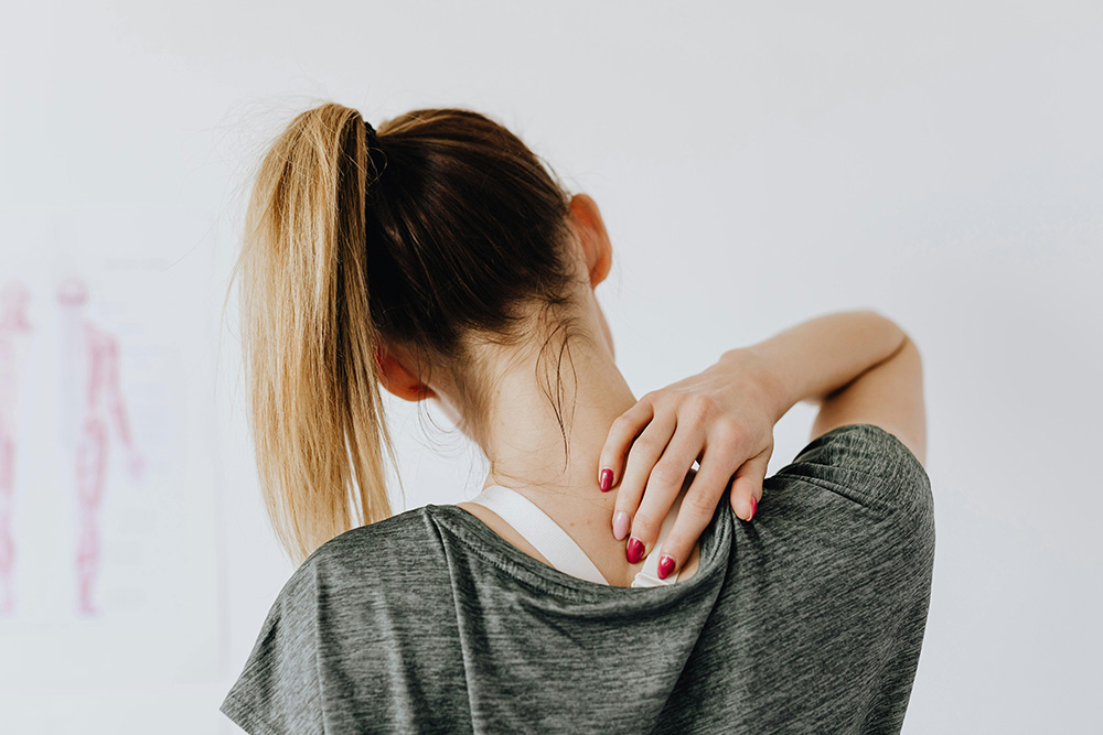 pexels-karolina-grabowska-4506105_Web Woman with neck pain