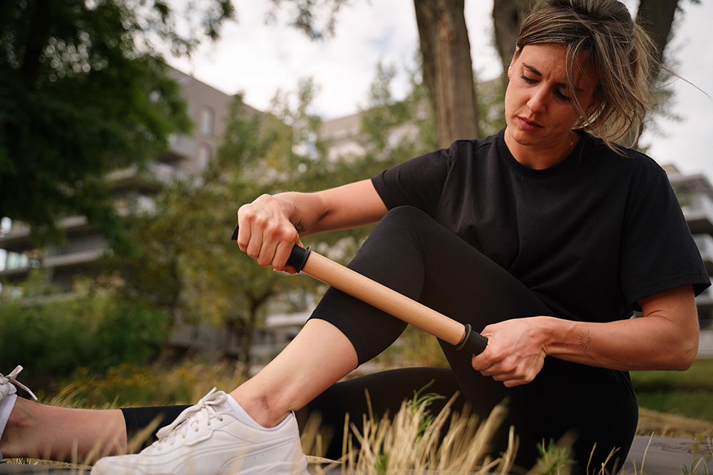 Use a massage roller, often specifically a calf muscle roller, hamstring roller, or general roller for thighs, to help relieve tension and improve muscle recovery in your lower body.