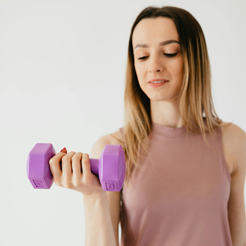 Woman with training her muscles