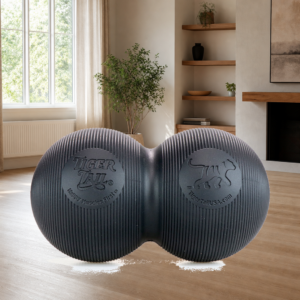 Person using a peanut foam roller for lower back knot relief